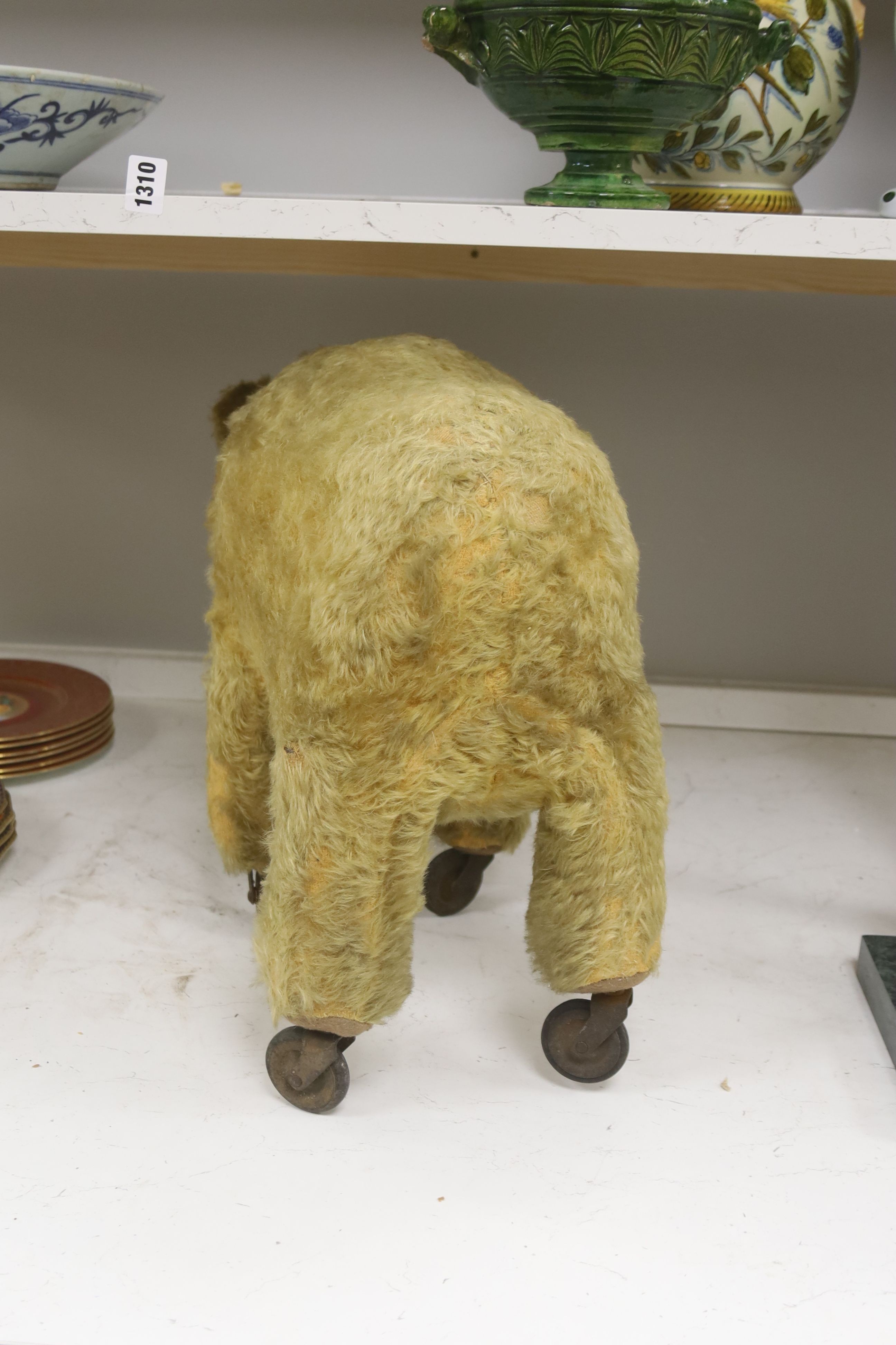 A blonde plush bear on wheels (put on later) 55cm